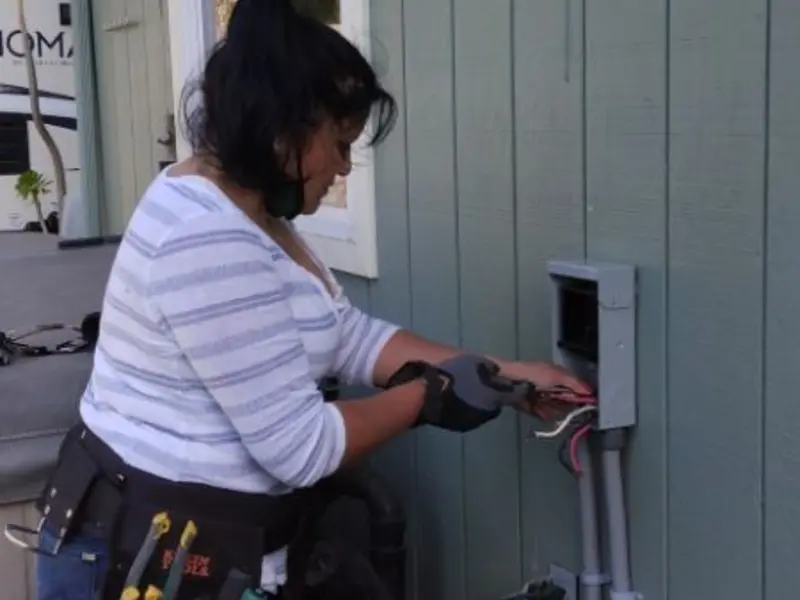 Licensed electrician wiring an exterior subpanel in El Cerro Mission