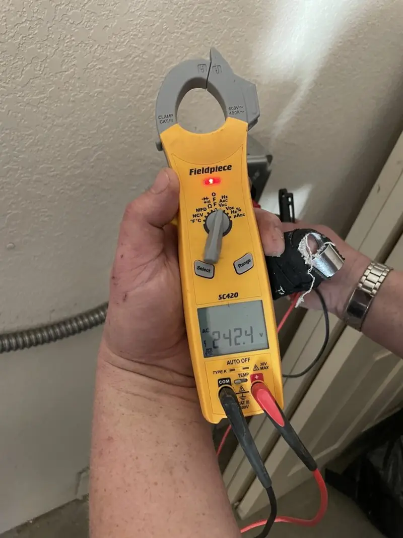 Voltage testing with clamp meter during Electrical Installation Services in El Cerro Mission